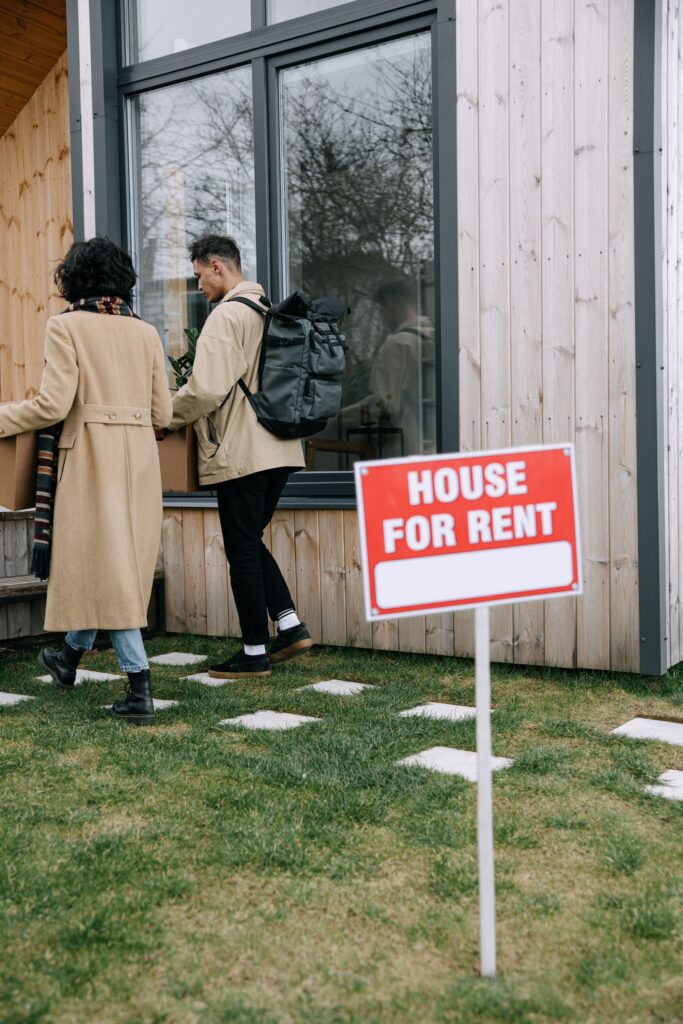 Prospective tenants moving into a single-family rental home, illustrating the type of income-producing residential properties financed through Sendero Capital's DSCR rental loan programs.